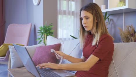 Woman-paying-online-with-bills-at-home.